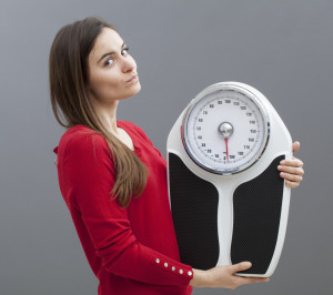 woman holding scale