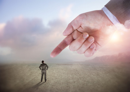 giant finger pointing at man