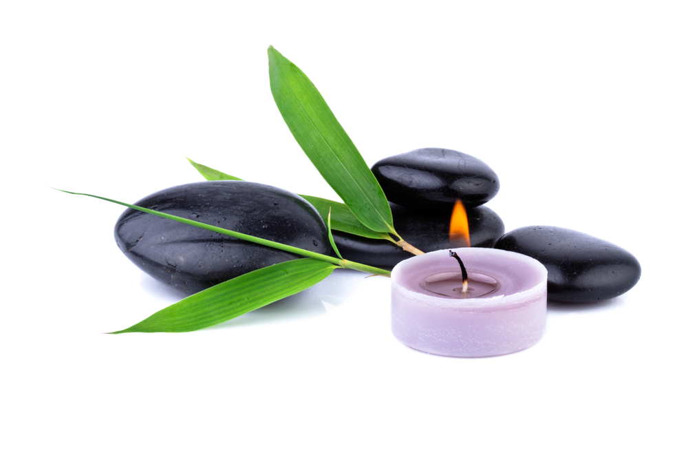 isolated candle and stones