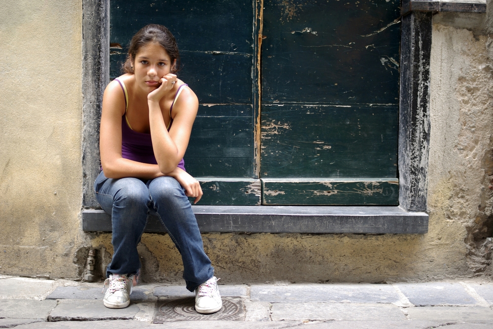 bored woman sitting on step
