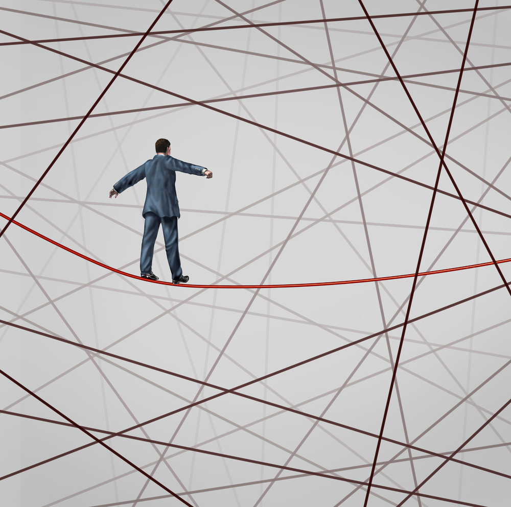 man balancing on tightrope