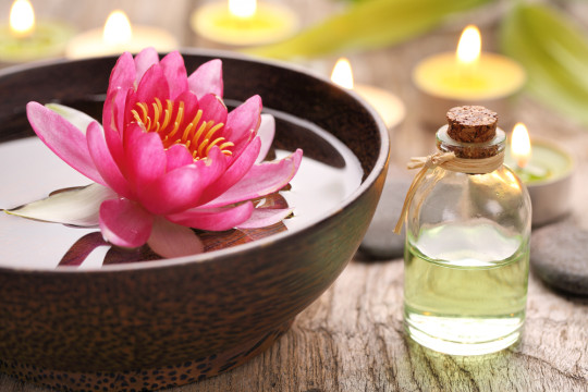 floating lotus flower and essential oil
