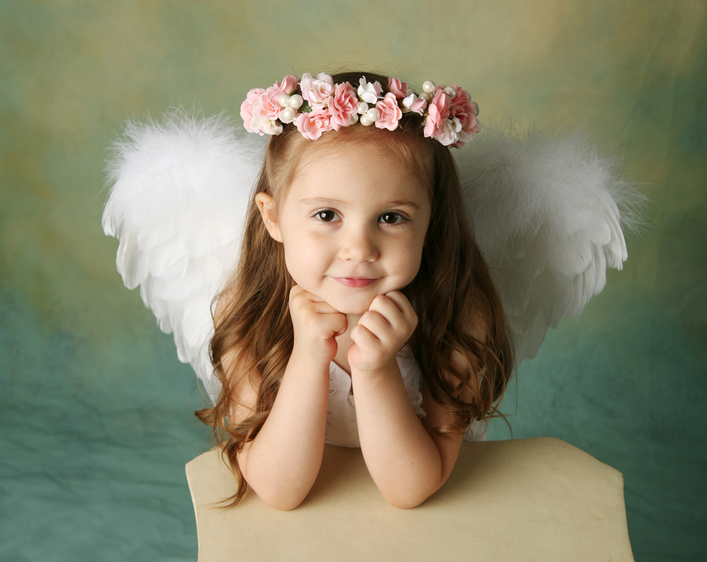 little girl dressed like an angel