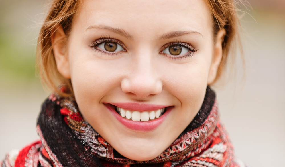 smiling woman expressing freedom, happiness, joy, letting go