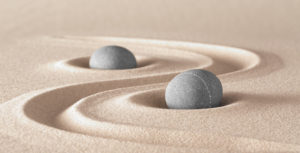 two stones with raked sand. Zen, harmony, peacefulness, meditation
