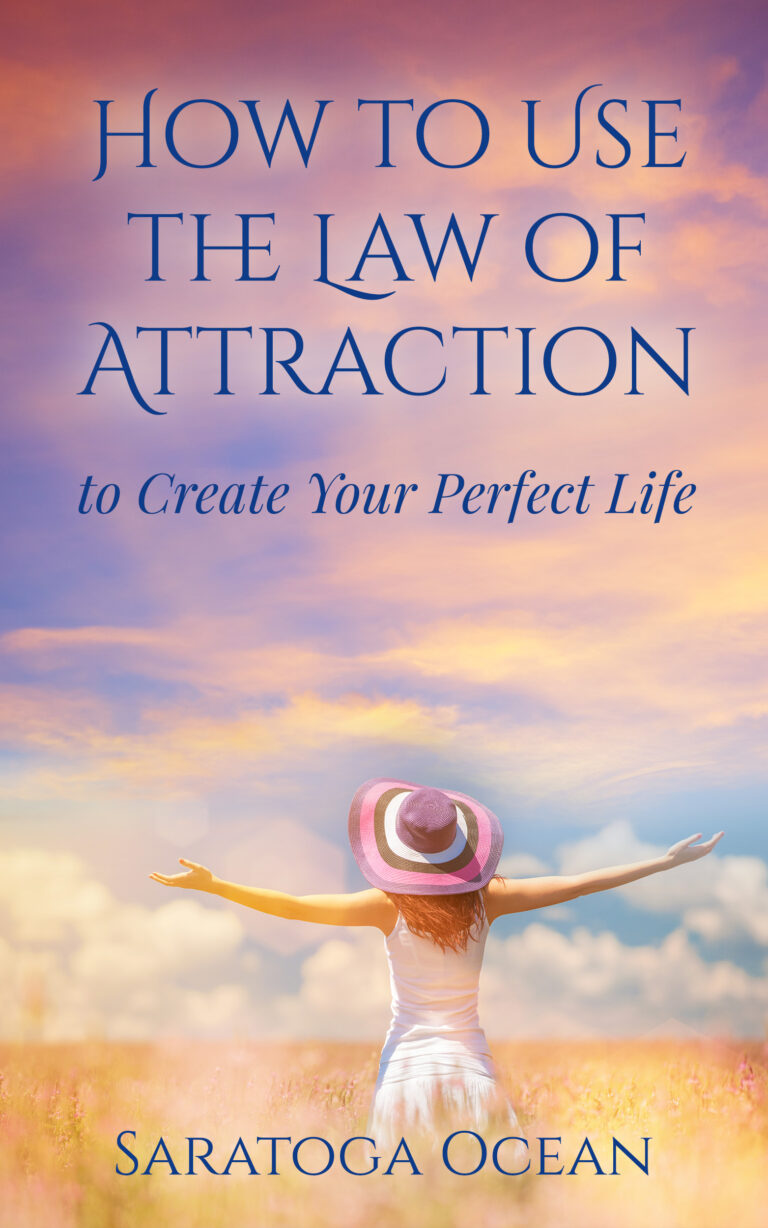 Book cover for "How to Use the Law of Attraction to Create Your Perfect Life" by Saratoga Ocean. The cover shows a woman in a white dress and purple hat, standing in a sunny field of grain with her arms stretched out joyfully.