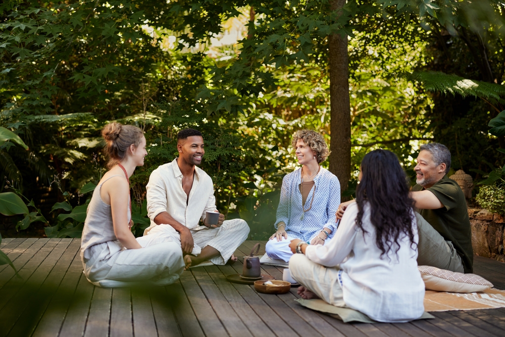 A small group in genuine conversation outdoors