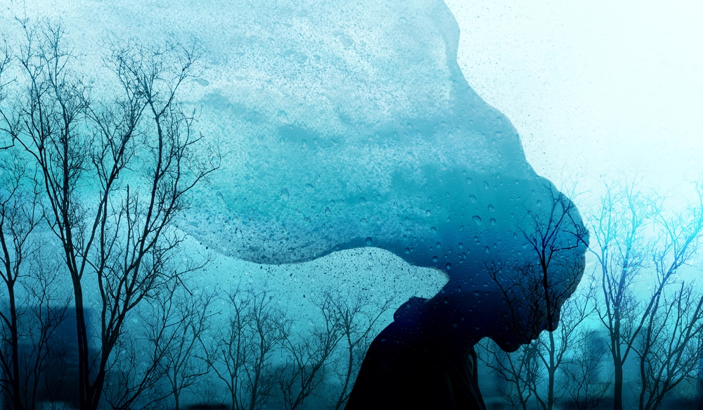blue and black artistic depiction of a woman collecting too much heavy energy
